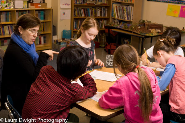 Teacher working with students in fourth grade classroom