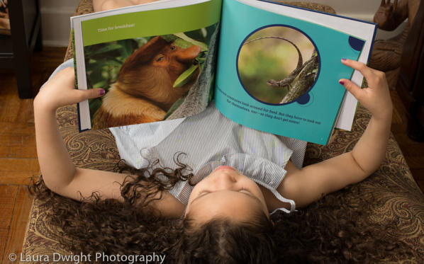 6 year old reading All in a Rainforest Day