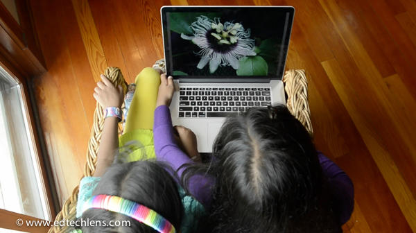 Two girls looking at Rainforest Journey life science curriculum on laptop computer Educational Technology Science Learning Website