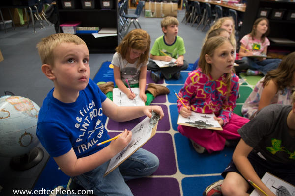 Students working on observation assignment during field testing of Rainforest Journey hands-on activity Attentive children Five Reasons for Theme-Based Learning